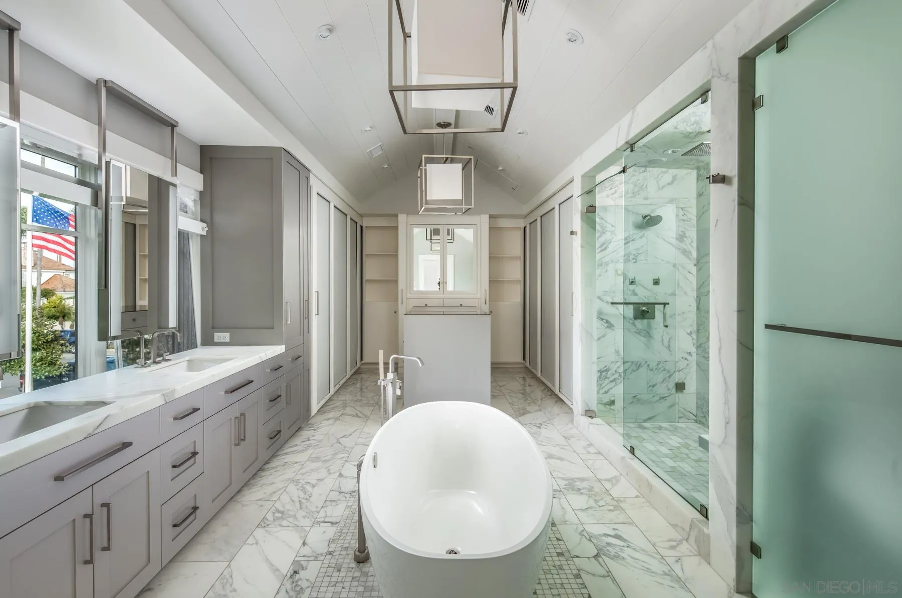 900 Alameda Boulevard Coronado, CA 92118 - Photo 21 of 30 a spacious bathroom with a double vanity sink a large mirror a shower and a bathtub