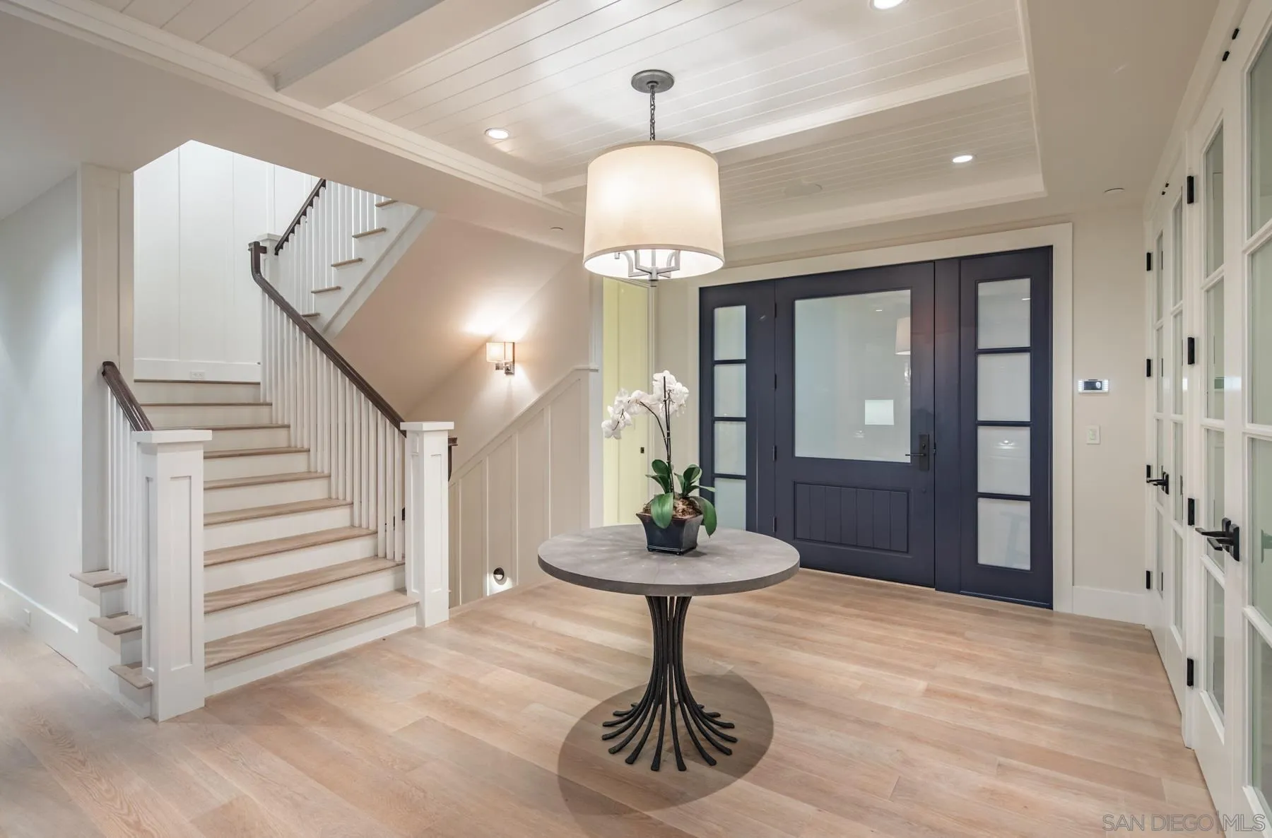 900 Alameda Boulevard Coronado, CA 92118 - Photo 4 of 30 a room with chandelier fan and wooden floor