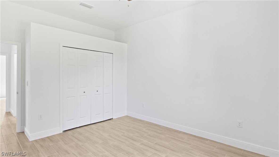 422 Progress Avenue Lehigh Acres, FL 33974 - Photo 20 of 35 a view of an empty room