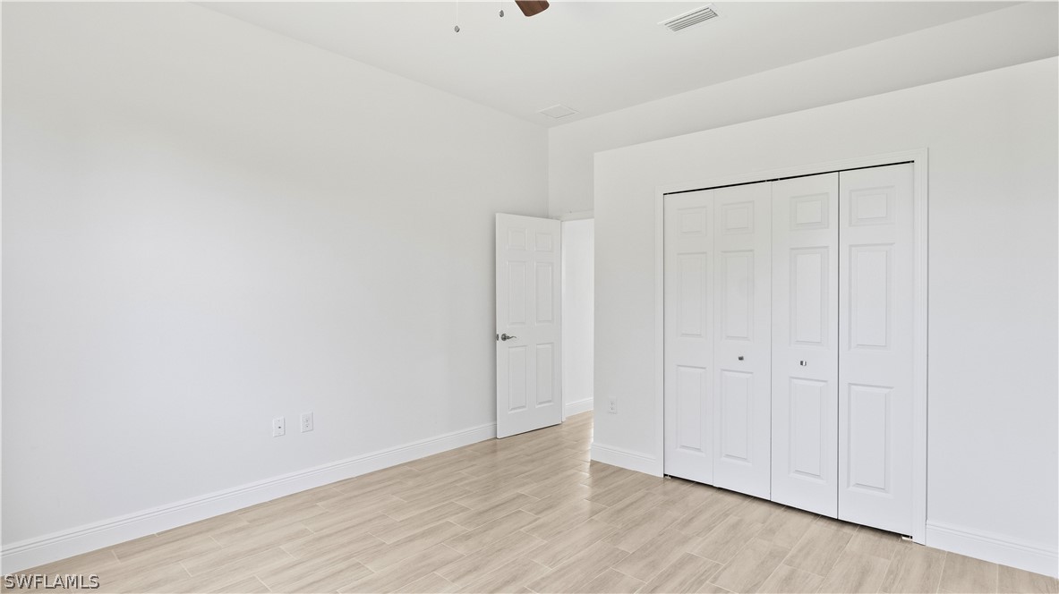 422 Progress Avenue Lehigh Acres, FL 33974 - Photo 21 of 35 a view of an empty room