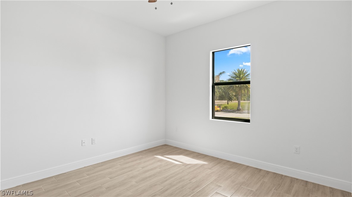 422 Progress Avenue Lehigh Acres, FL 33974 - Photo 27 of 35 an empty room with a window