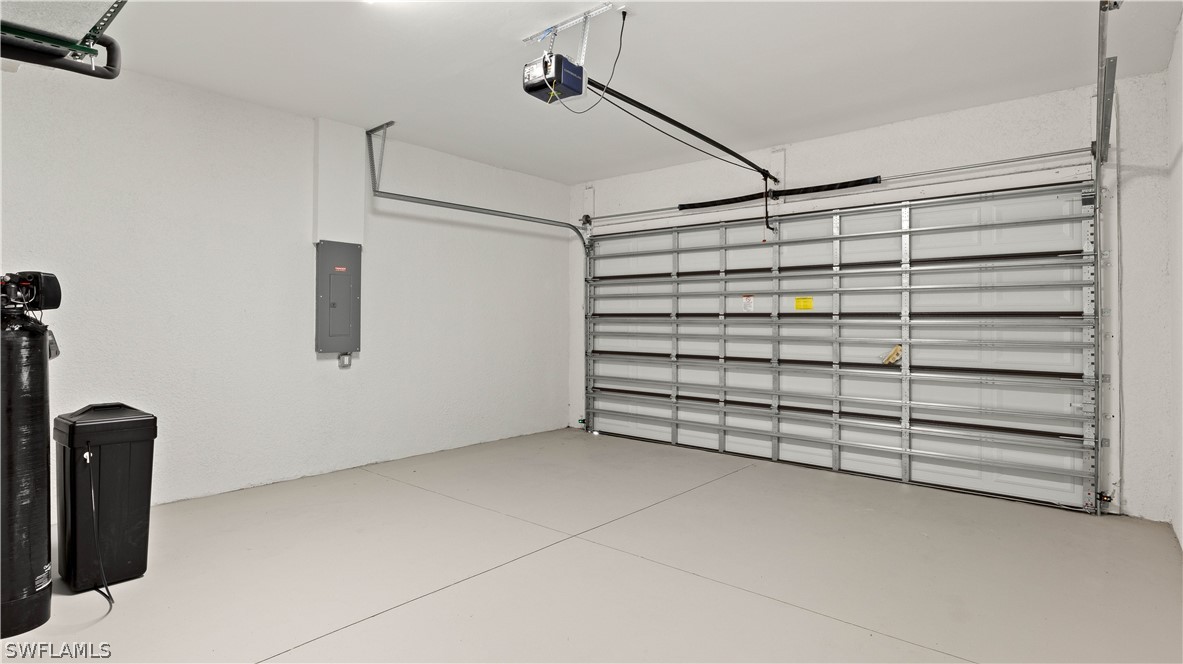 422 Progress Avenue Lehigh Acres, FL 33974 - Photo 28 of 35 a view of a garage with storage