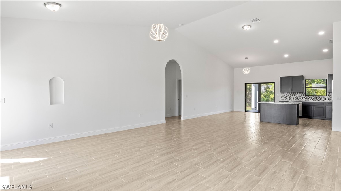 422 Progress Avenue Lehigh Acres, FL 33974 - Photo 4 of 35 a view of a kitchen with a sink and a microwave