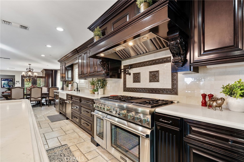 4738 Live Oak Canyon Road La Verne, CA 91750 - Photo 11 of 70 a kitchen with stainless steel appliances granite countertop a stove and a sink