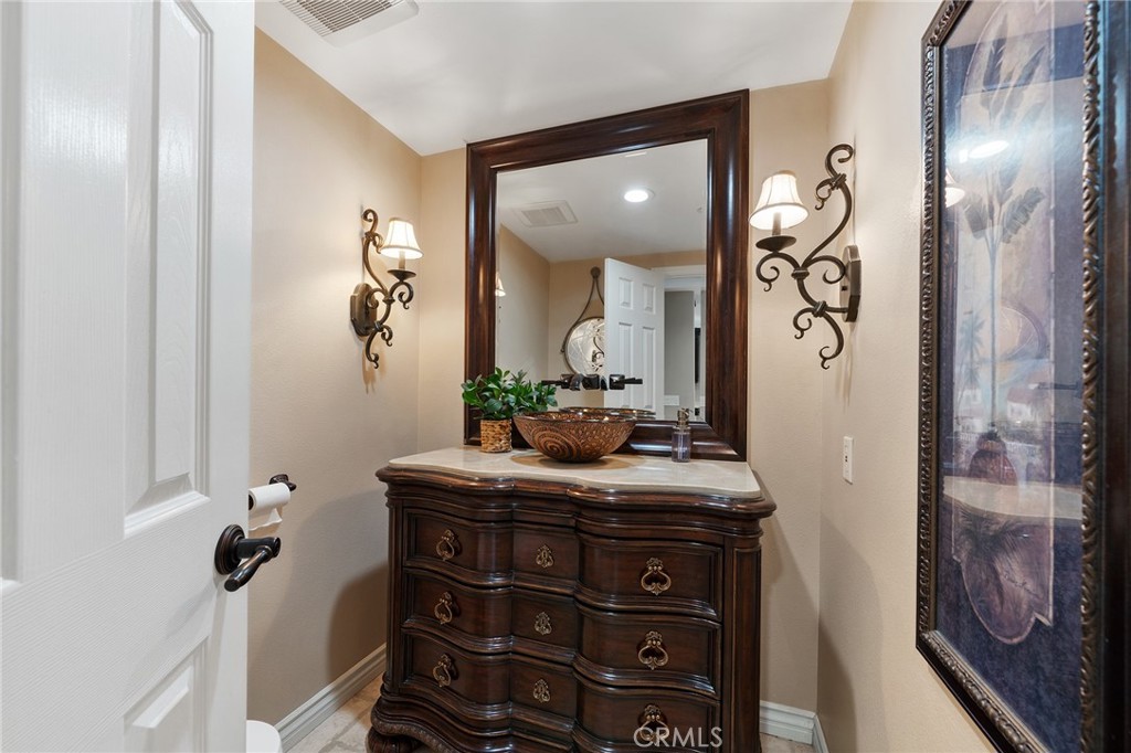 4738 Live Oak Canyon Road La Verne, CA 91750 - Photo 26 of 70 a bathroom with a sink a mirror and vanity