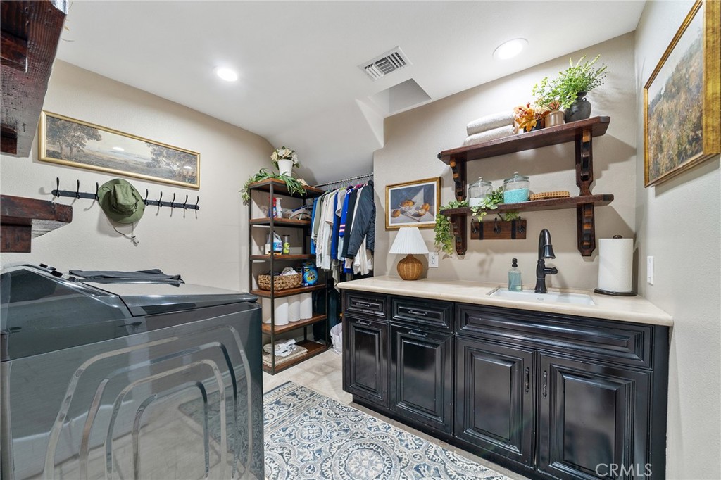 4738 Live Oak Canyon Road La Verne, CA 91750 - Photo 27 of 70 a kitchen with stainless steel appliances granite countertop a stove and cabinets
