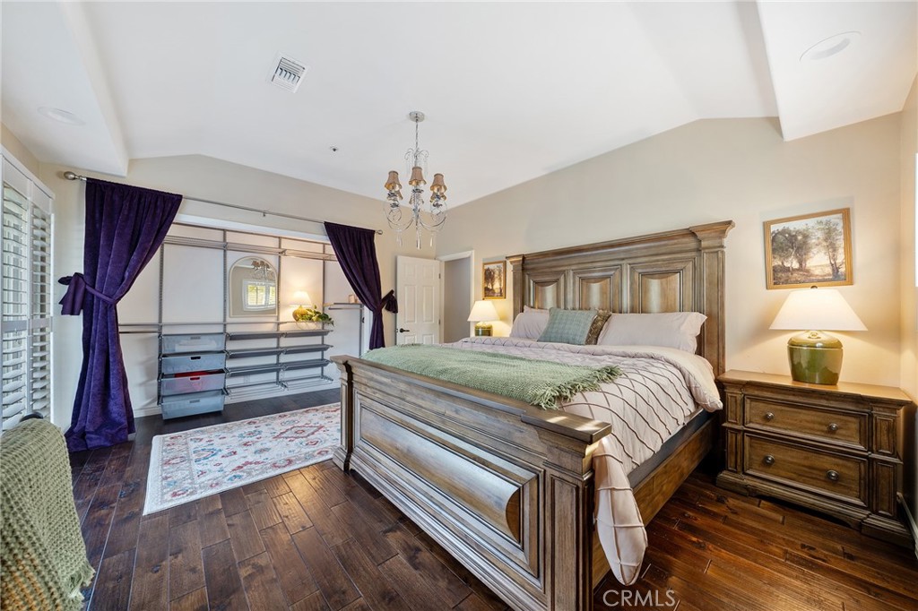 4738 Live Oak Canyon Road La Verne, CA 91750 - Photo 39 of 70 a bedroom with a bed and wooden floor