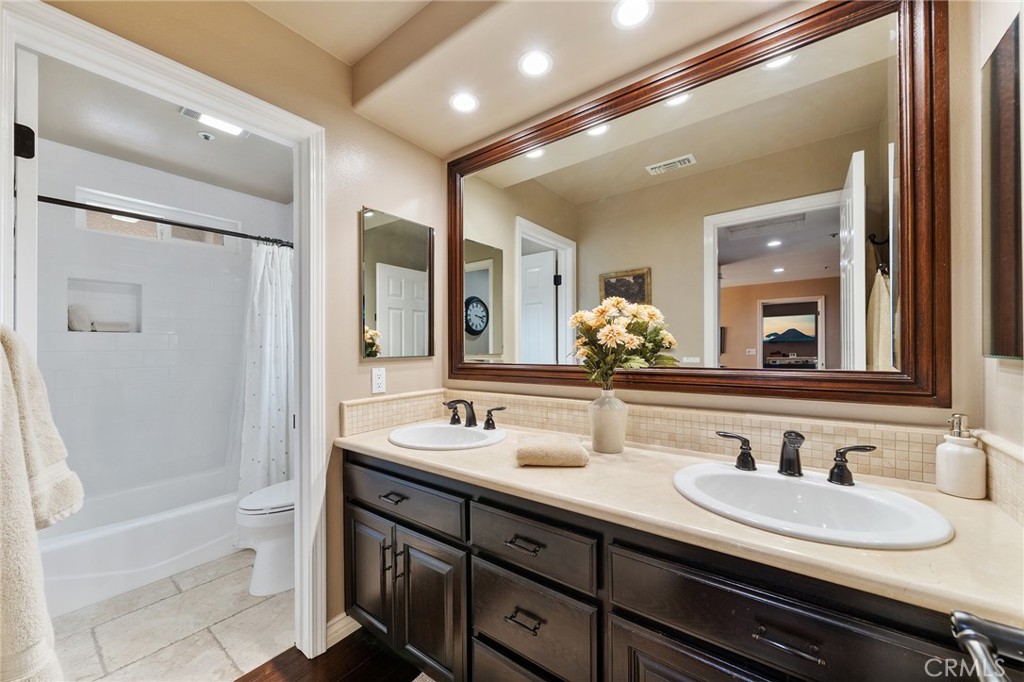 4738 Live Oak Canyon Road La Verne, CA 91750 - Photo 41 of 70 a bathroom with a sink a toilet and shower