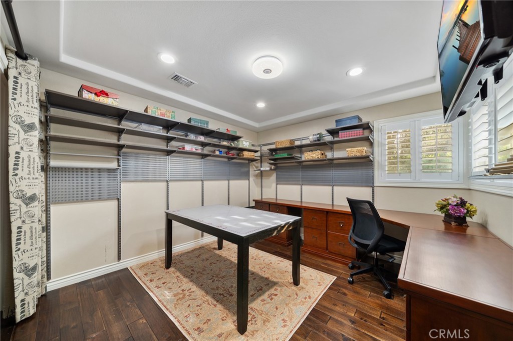 4738 Live Oak Canyon Road La Verne, CA 91750 - Photo 42 of 70 a workspace with furniture and wooden floor