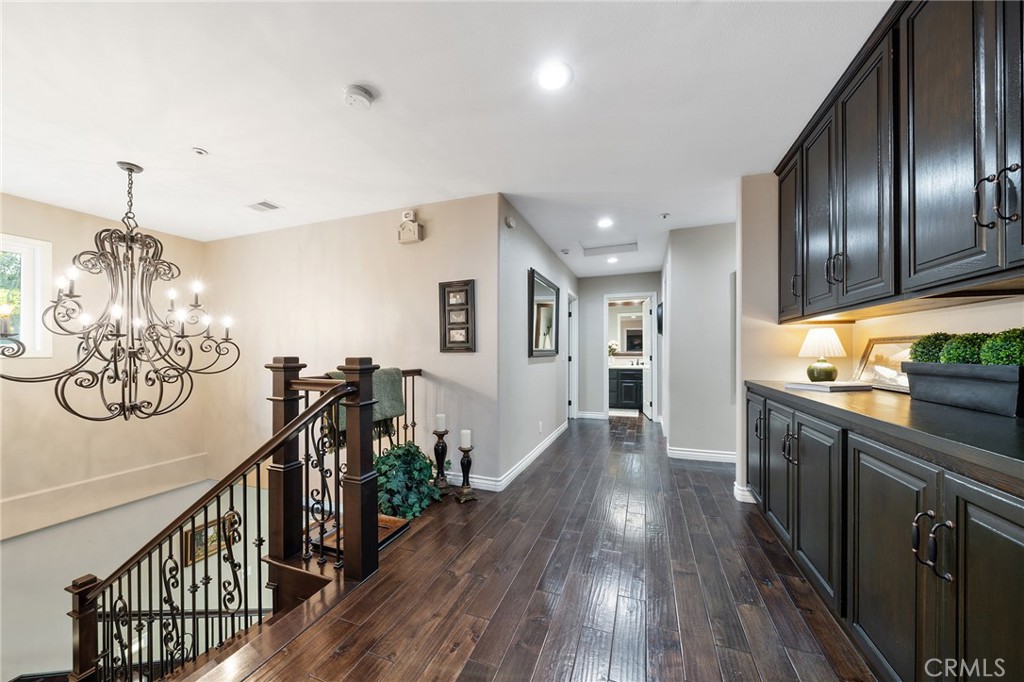 4738 Live Oak Canyon Road La Verne, CA 91750 - Photo 44 of 70 a view of a kitchen with wooden floor and stainless steel appliances
