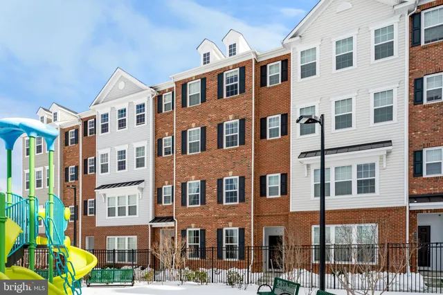 a front view of a building with a garden