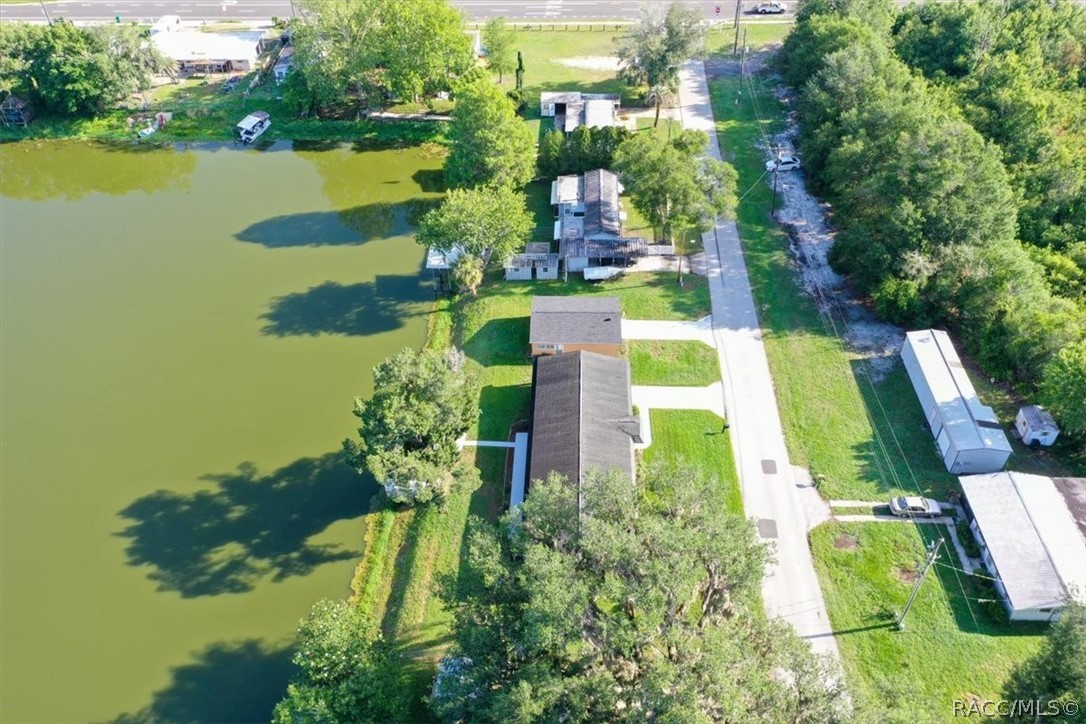 928 South Shad Terrace Inverness, FL 34450 - Photo 44 of 48 an aerial view of a house with a garden and lake view