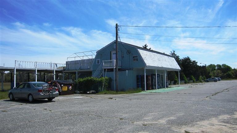 4790 State Highway Eastham, MA 02642 - Photo 5 of 9 a car parked in front of house