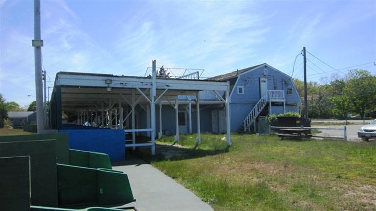 4790 State Highway Eastham, MA 02642 - Photo 6 of 9 a view of a house next to a yard