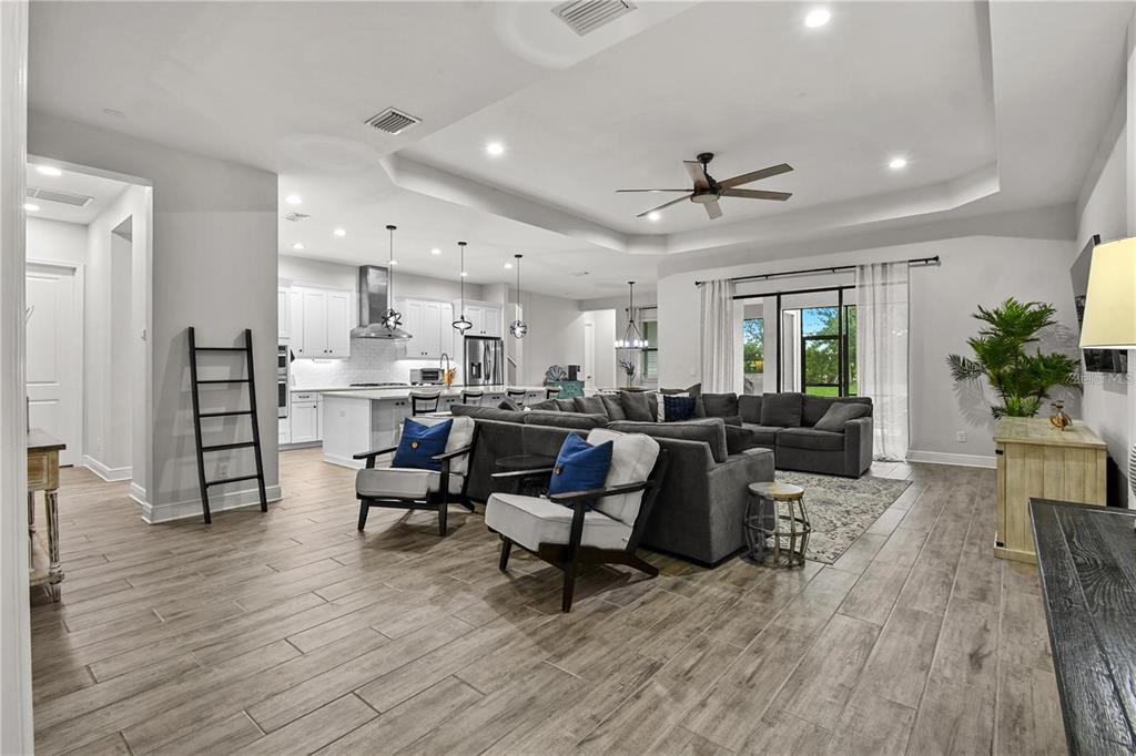 4423 Fly Rod Terrace Parrish, FL 34219 - Photo 18 of 89 a living room with furniture and a wooden floor