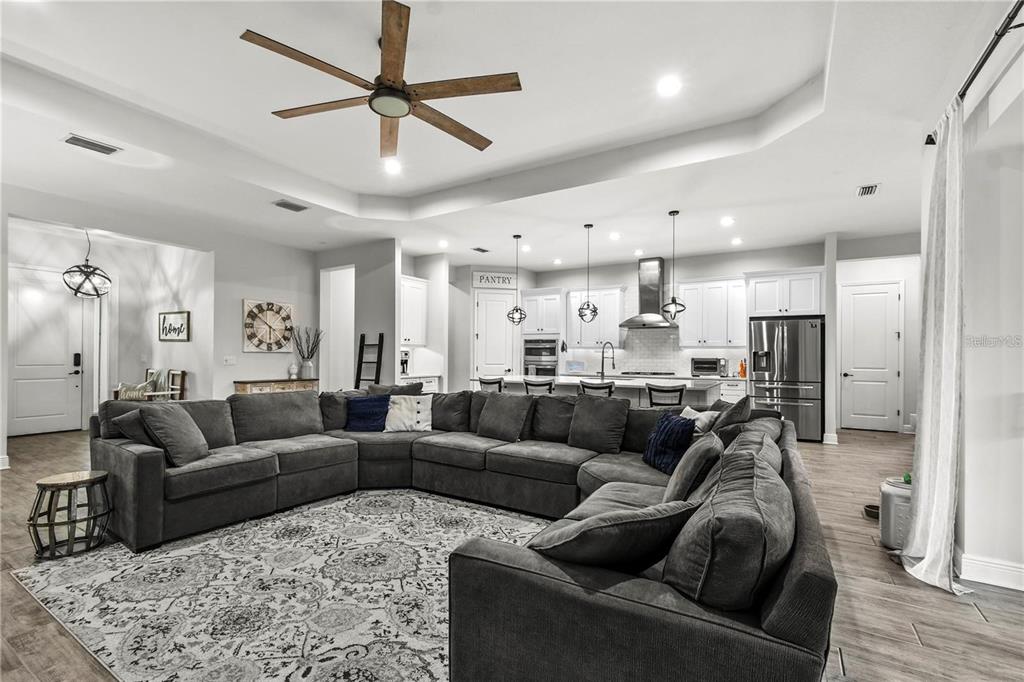 4423 Fly Rod Terrace Parrish, FL 34219 - Photo 20 of 89 a living room with furniture and a view of kitchen