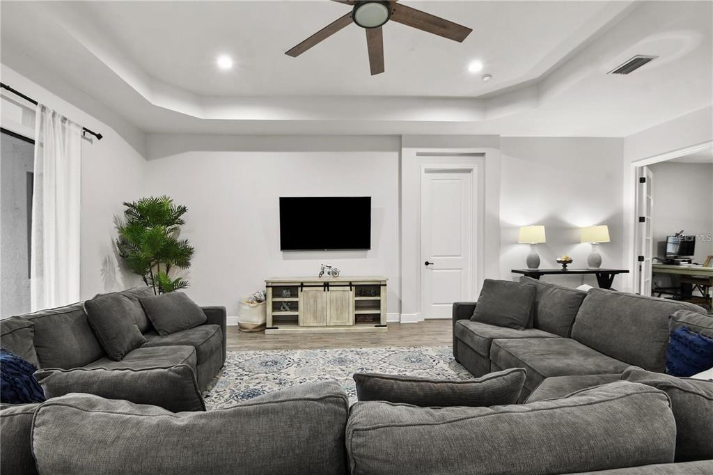 4423 Fly Rod Terrace Parrish, FL 34219 - Photo 24 of 89 a living room with furniture and a flat screen tv