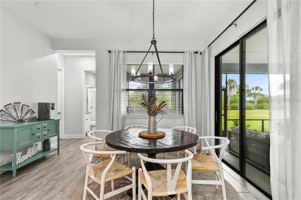 4423 Fly Rod Terrace Parrish, FL 34219 - Photo 25 of 89 a dining room with furniture and window