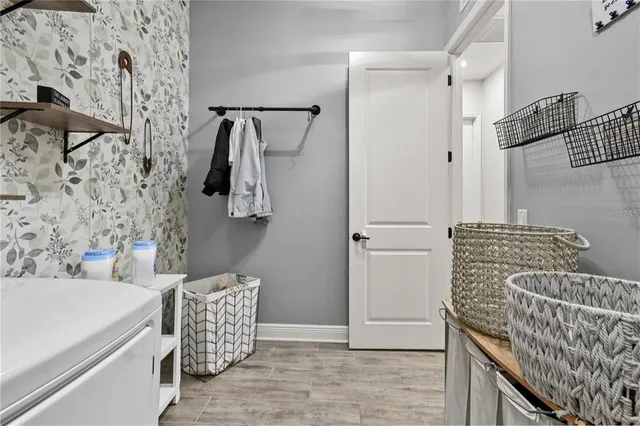 an aerial view of a house with garden space and ocean view