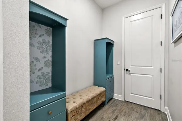 an aerial view of a house with a lake view