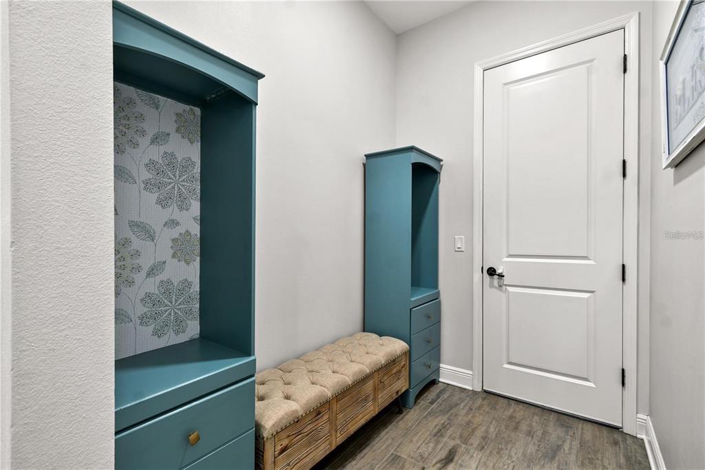 4423 Fly Rod Terrace Parrish, FL 34219 - Photo 40 of 89 a bedroom with a bed and a mirror