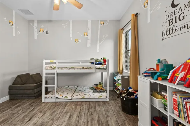 an aerial view of lake with residential houses with outdoor space and swimming pool