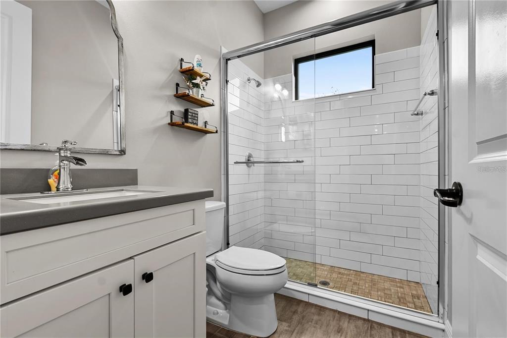 4423 Fly Rod Terrace Parrish, FL 34219 - Photo 49 of 89 a bathroom with a sink a toilet and shower