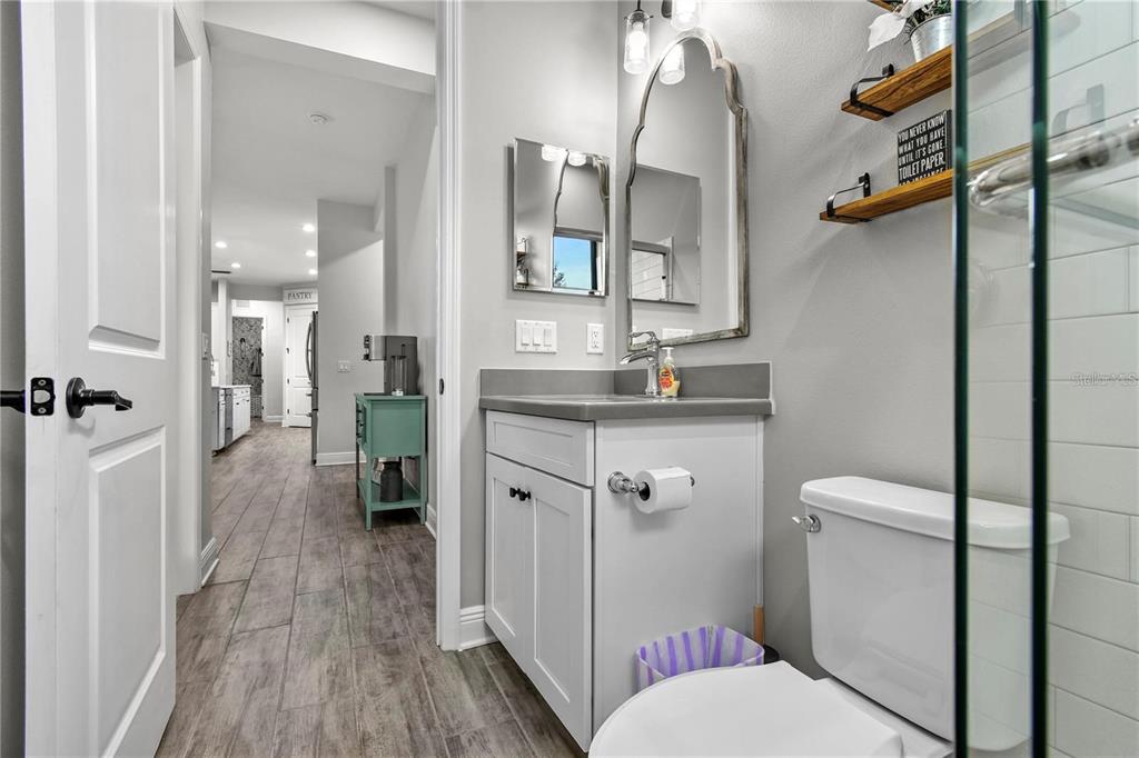 4423 Fly Rod Terrace Parrish, FL 34219 - Photo 50 of 89 a bathroom with a sink and mirror with toilet