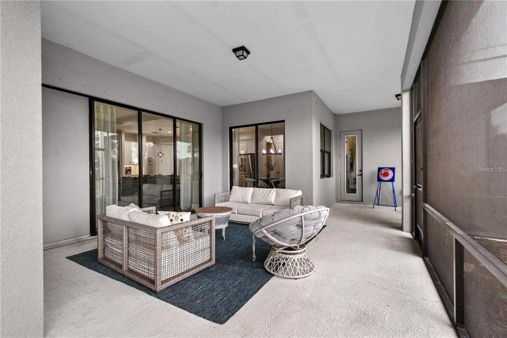 4423 Fly Rod Terrace Parrish, FL 34219 - Photo 54 of 89 a living room with furniture and a large window