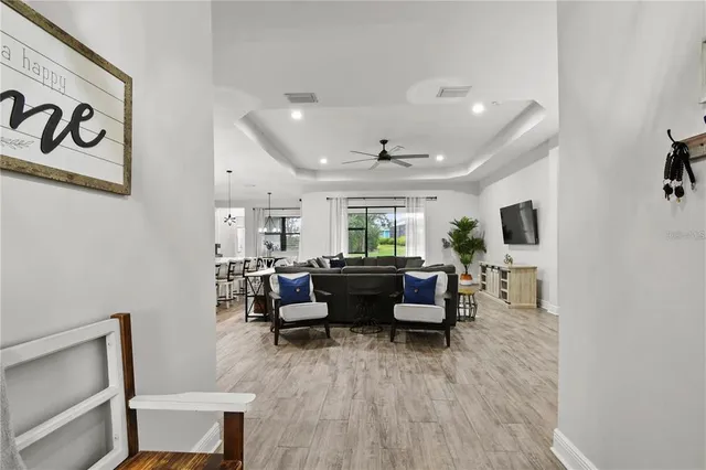 a living room with lots of furniture and a flat screen tv