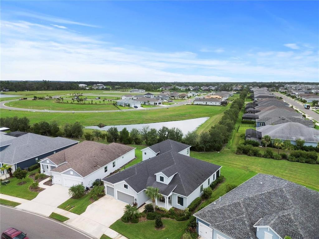 4423 Fly Rod Terrace Parrish, FL 34219 - Photo 63 of 89 an aerial view of a house with a garden