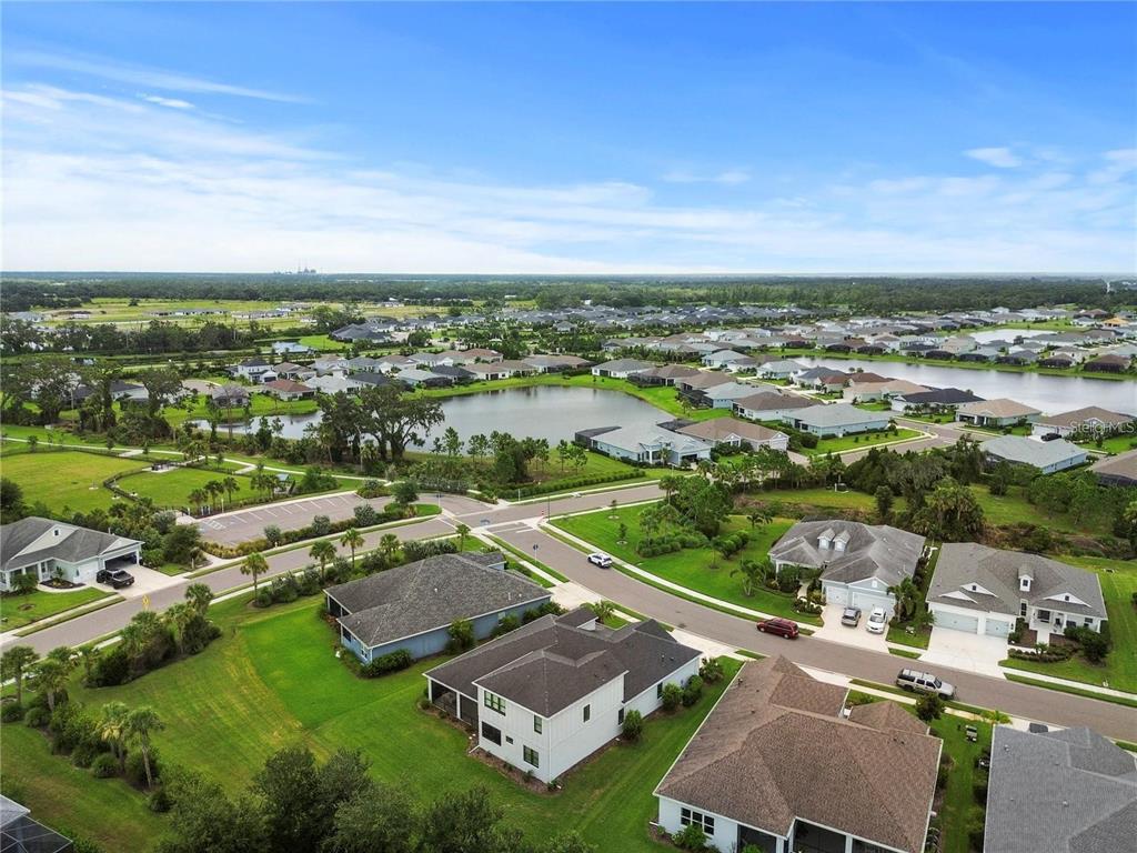 4423 Fly Rod Terrace Parrish, FL 34219 - Photo 65 of 89 an aerial view of residential houses with outdoor space