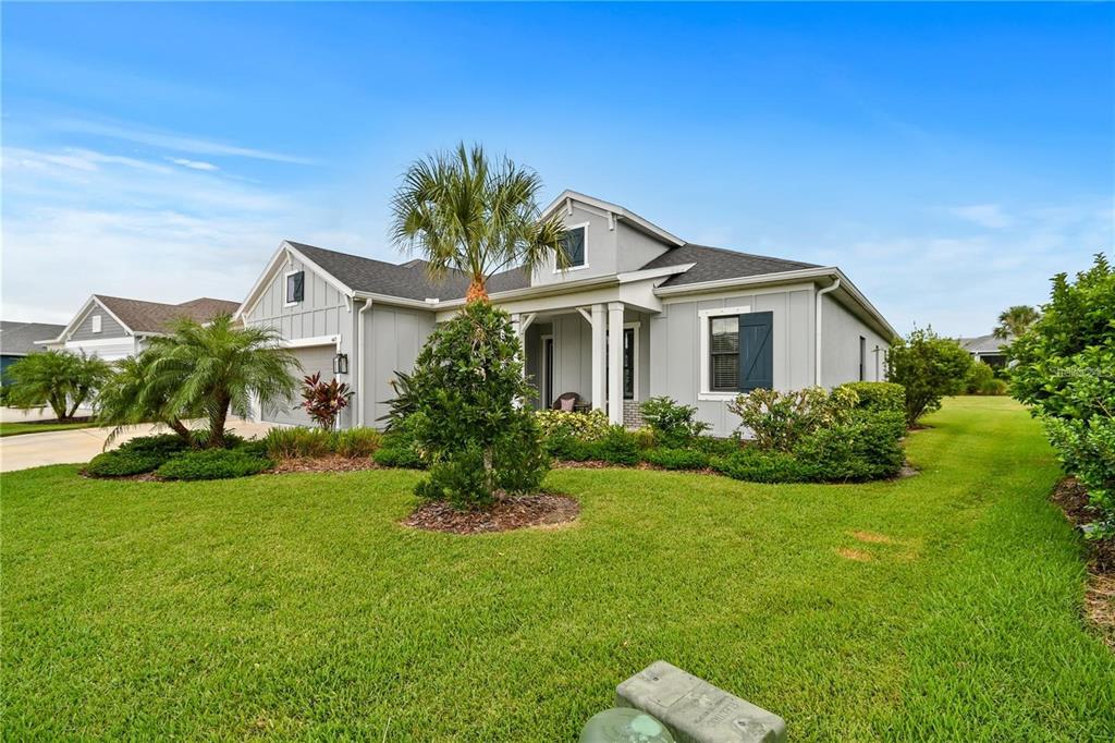 4423 Fly Rod Terrace Parrish, FL 34219 - Photo 67 of 89 a front view of a house with a garden and plants