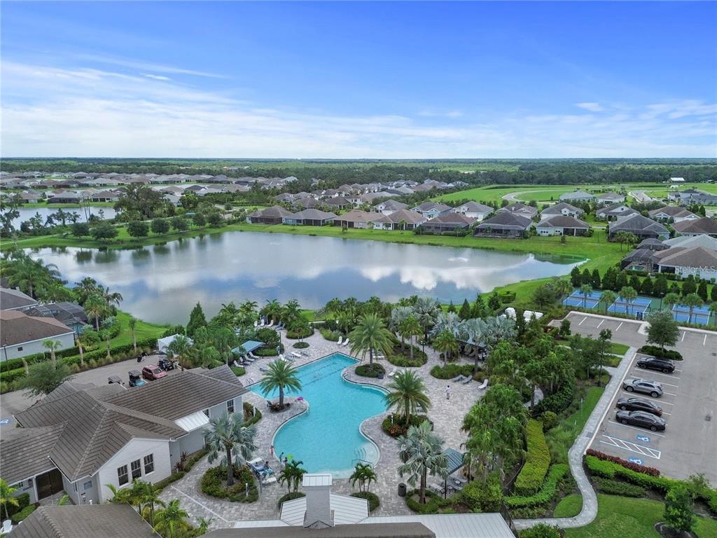 4423 Fly Rod Terrace Parrish, FL 34219 - Photo 69 of 89 an aerial view of a house with a lake view