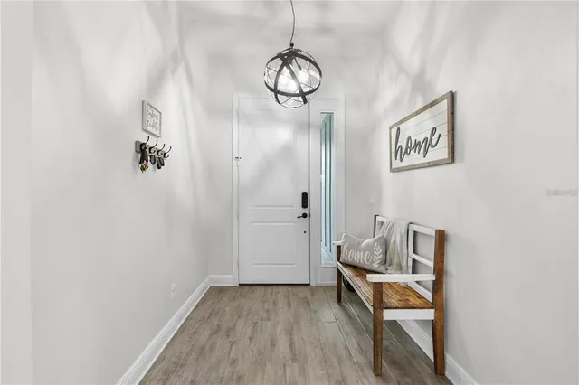 a view of a livingroom with furniture and a flat screen tv