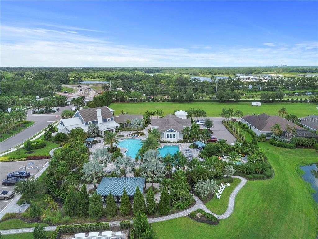4423 Fly Rod Terrace Parrish, FL 34219 - Photo 72 of 89 an aerial view of a house with garden space and outdoor seating