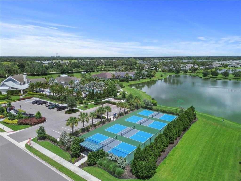 4423 Fly Rod Terrace Parrish, FL 34219 - Photo 74 of 89 an aerial view of a house with a lake view