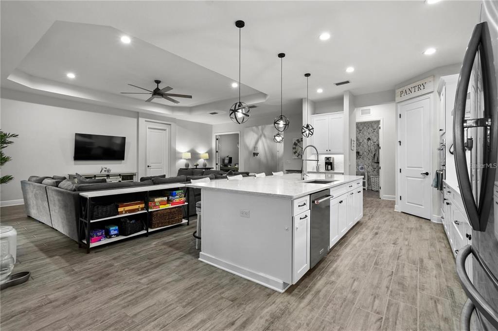 4423 Fly Rod Terrace Parrish, FL 34219 - Photo 10 of 89 a kitchen with a stove a sink and a refrigerator