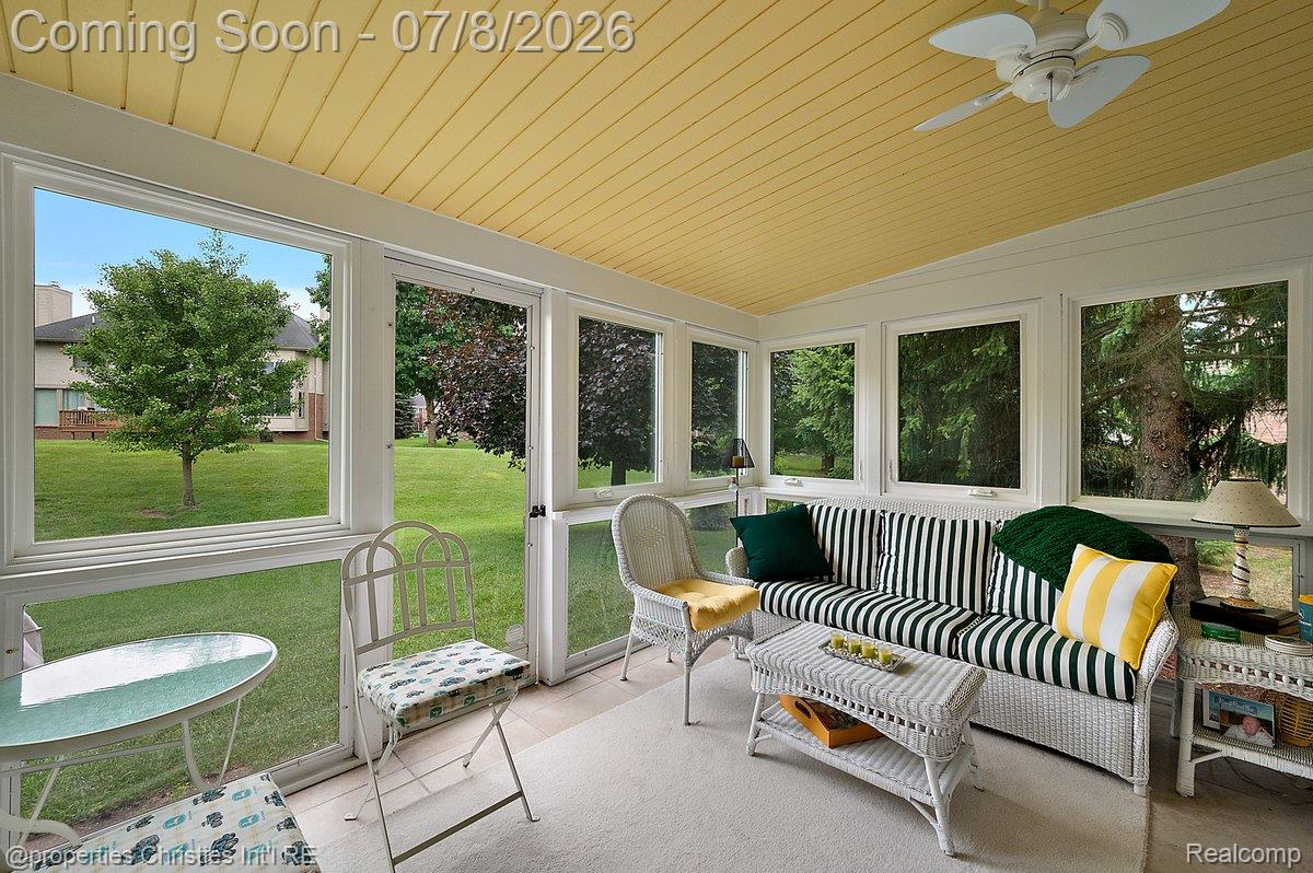 1946 Dunham Drive Rochester, MI 48306 - Photo 19 of 38 Sunroom featuring a beadboard ceiling with a ceiling fan