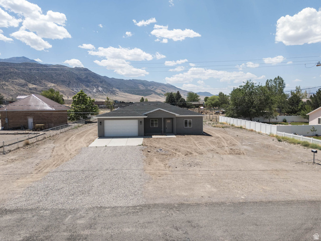 51 West 500 South Monroe, UT 84754 - Photo 32 of 41 Contemporary single-story residence featuring a two-car garage with a white door