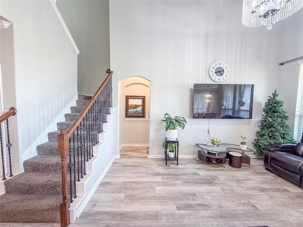 328 Callaghan Drive Fate, TX 75189 - Photo 21 of 37 a living room with furniture and a potted plant