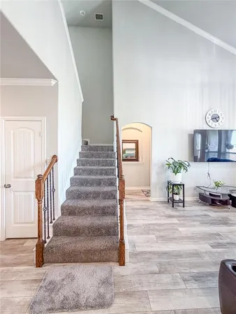 a kitchen with kitchen island granite countertop a sink a counter top space and stainless steel appliances