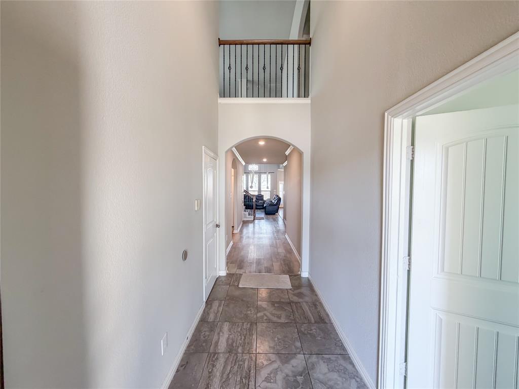 328 Callaghan Drive Fate, TX 75189 - Photo 3 of 37 a view of a hallway with a white walls