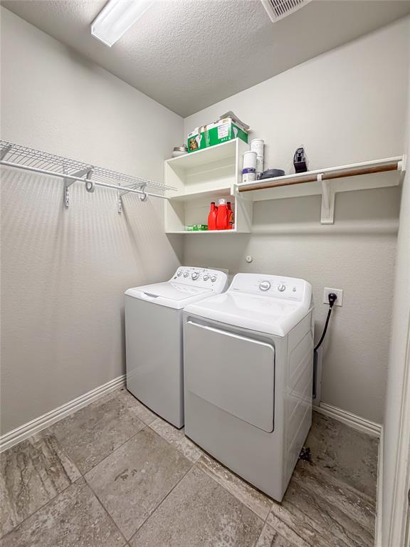 328 Callaghan Drive Fate, TX 75189 - Photo 31 of 37 a utility room with dryer and washer