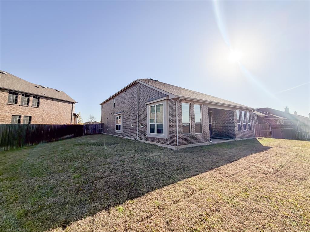 328 Callaghan Drive Fate, TX 75189 - Photo 33 of 37 a view of a house with backyard