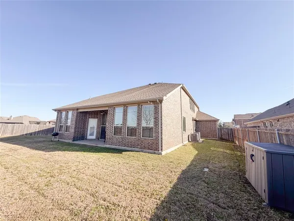 a view of a livingroom with furniture and a window