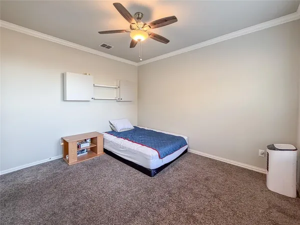 a room with furniture and a ceiling fan