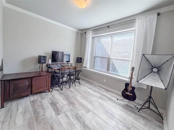 a workspace with furniture window and wooden floor