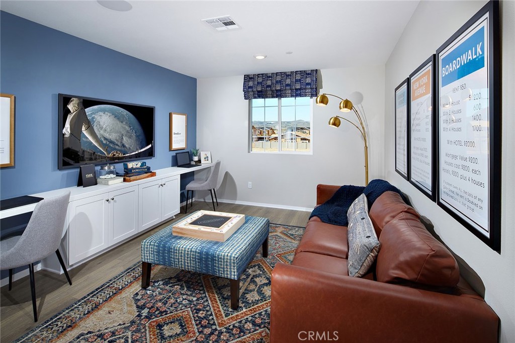 31099 Scrub Jay Road Winchester, CA 92596 - Photo 6 of 9 a living room with furniture a window and a flat screen tv