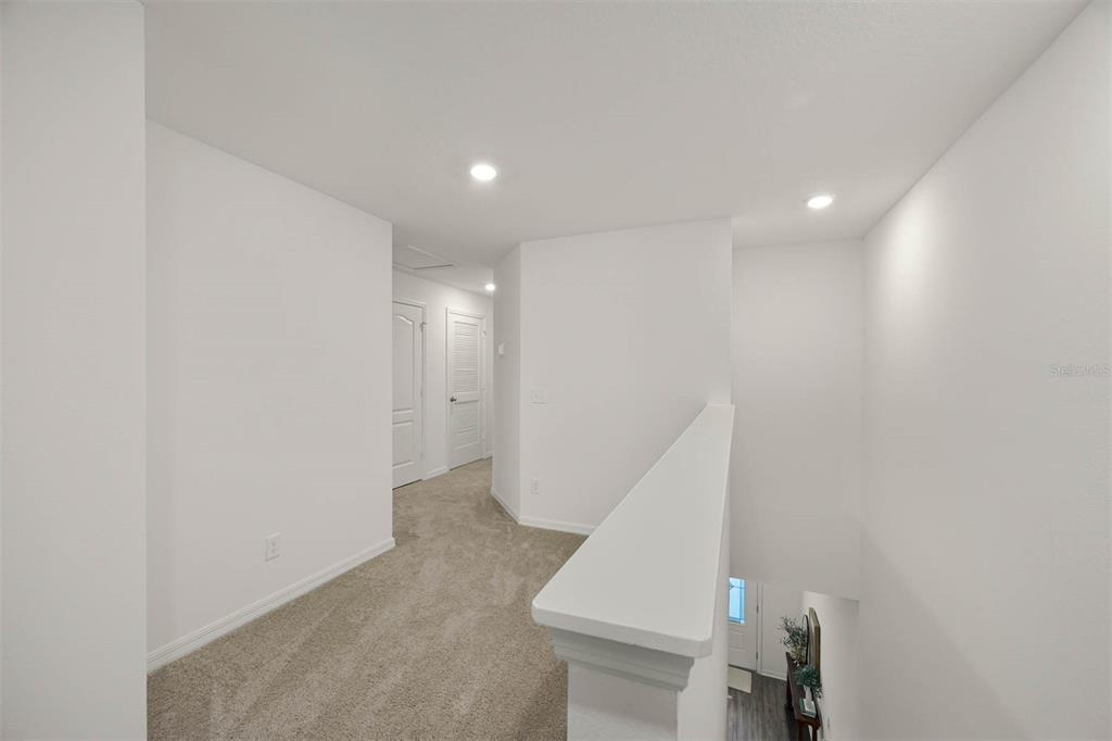 721 Poppy Lane Dundee, FL 33838 - Photo 14 of 26 a view of hallway with stairs